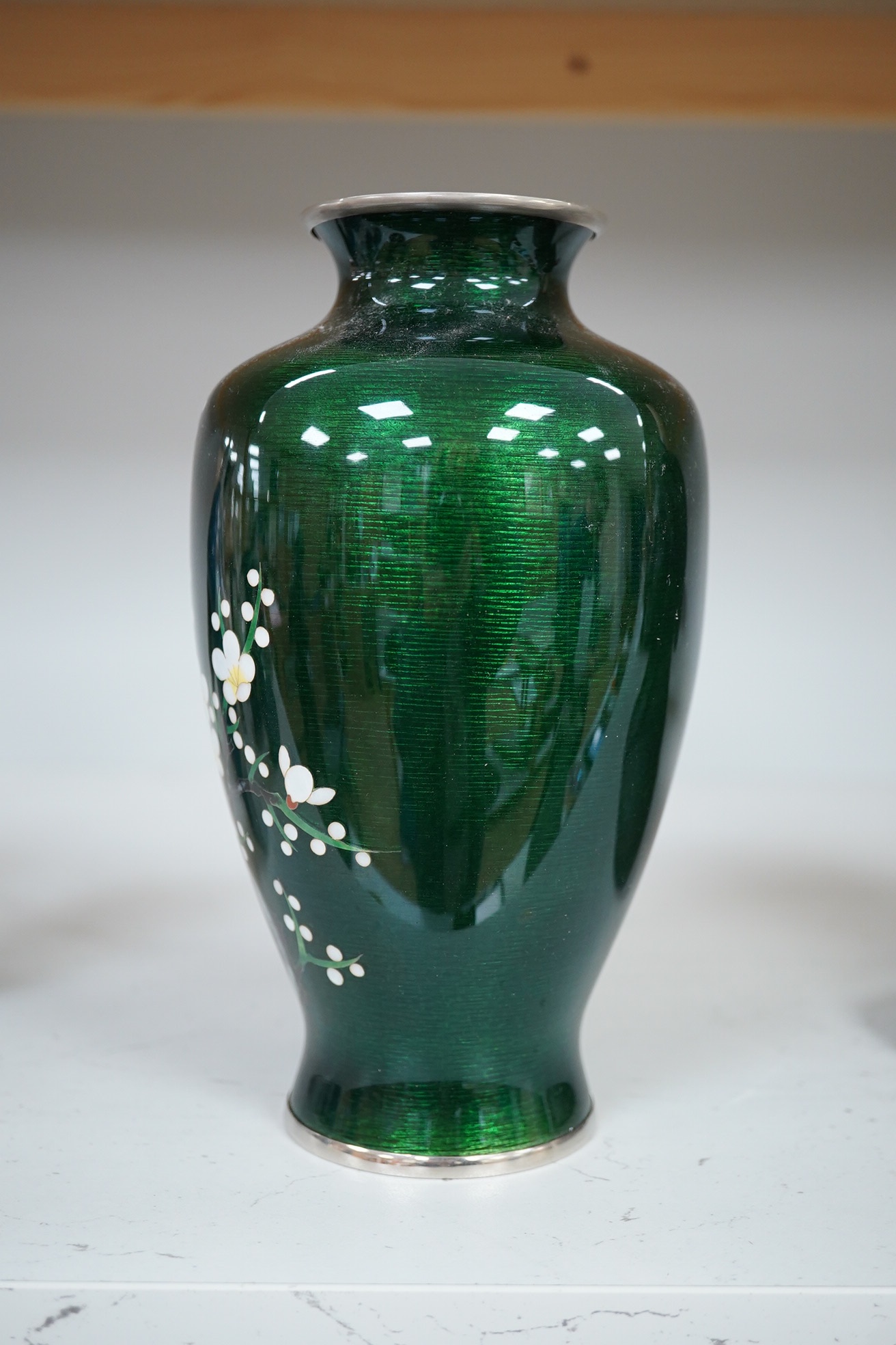 A mid 20th century Japanese green prunus silver wire cloisonné enamel vase, by Ando, 19cm high., Condition - good